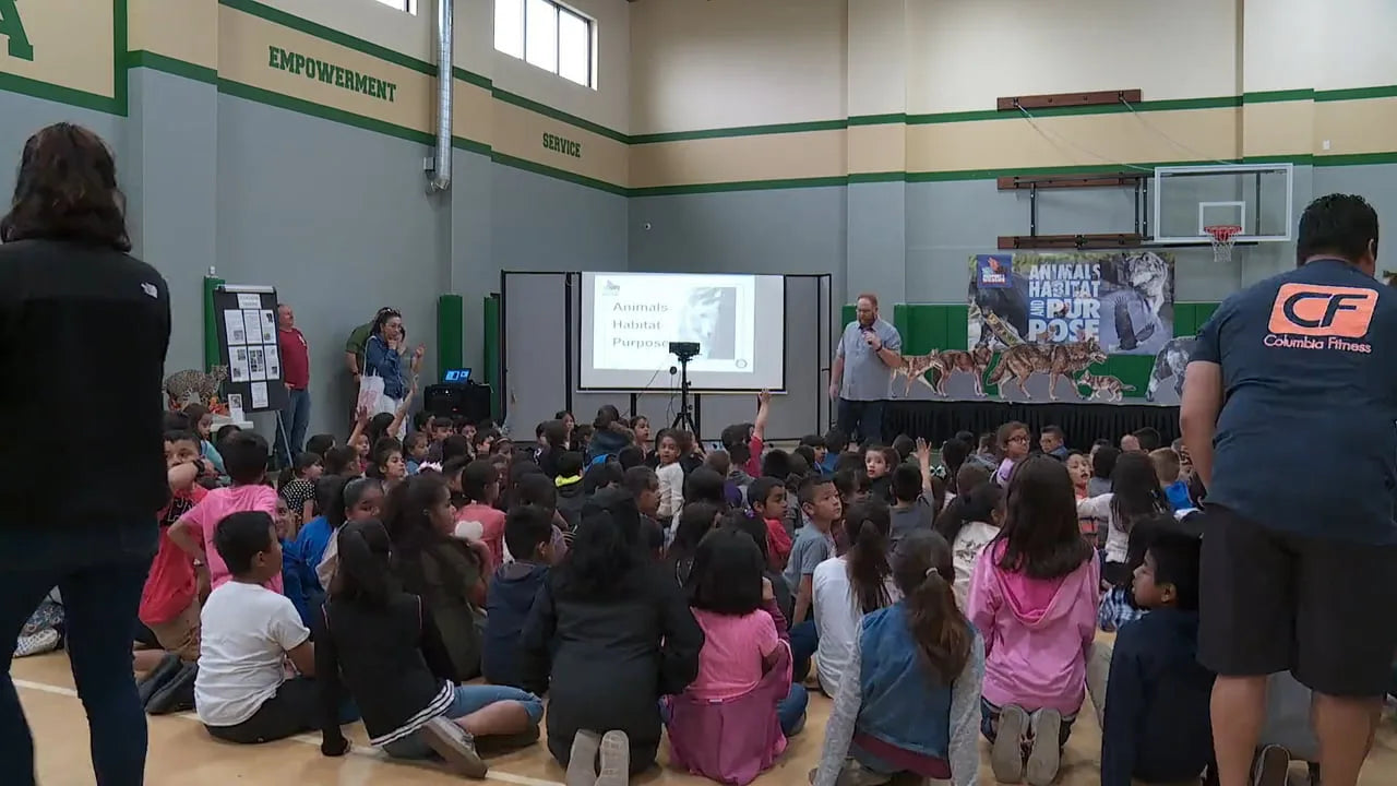 Students at a Passport to Wildlife school assembly